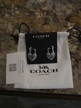 Coach Signature C Quilted Broken Heart Padlock Earrings, feat a padlock design